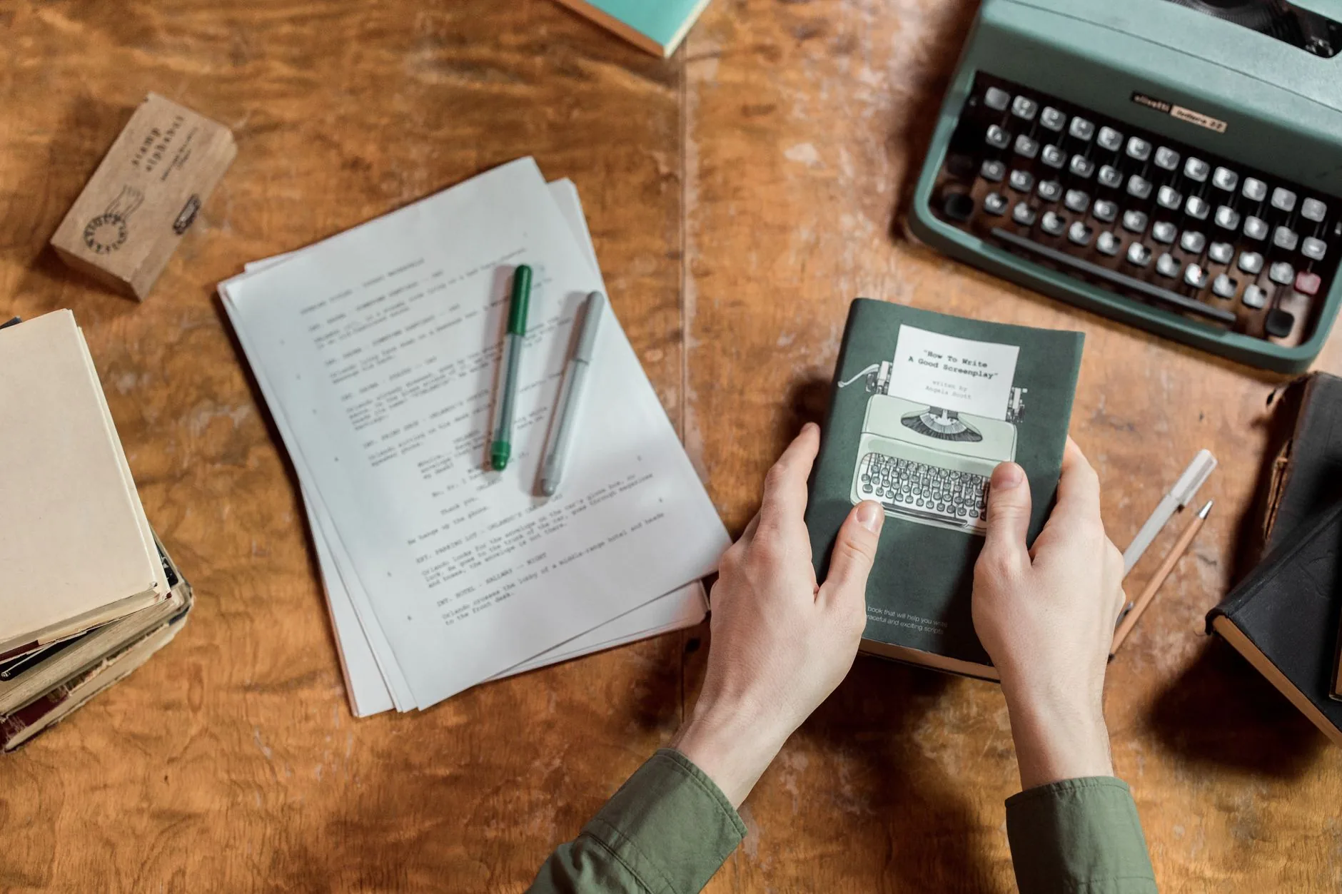 Vintage typewriter on cluttered desk, sunlight streaming in, spelling variations in publishing.