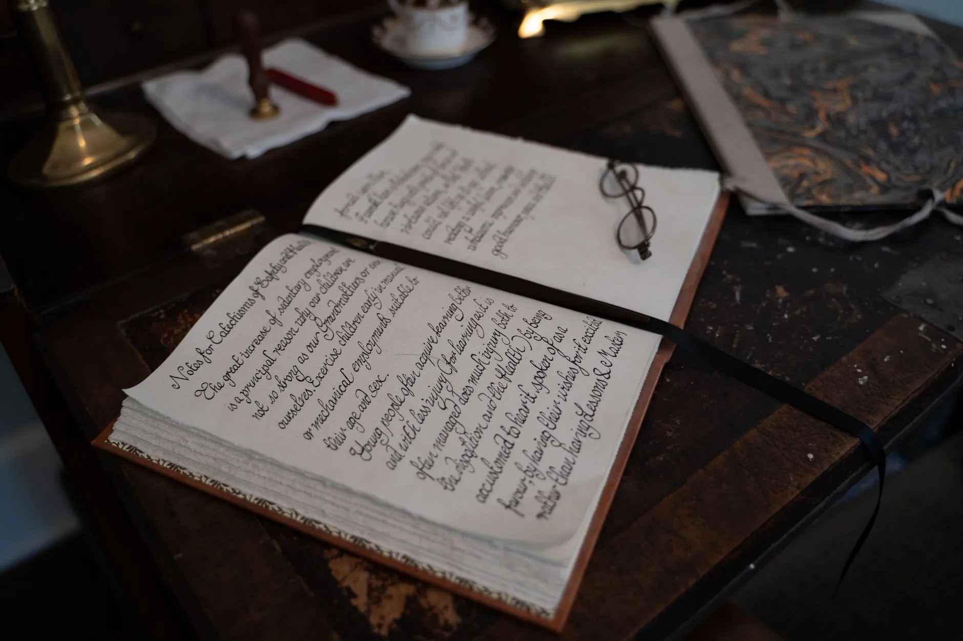 A cluttered writer's study with books and papers, soft lighting, mastering third person narrative.